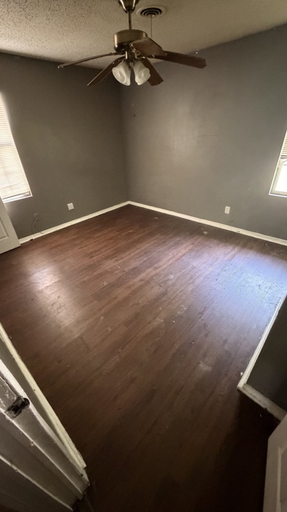 The same room emptied and clean after Loredo Hauling